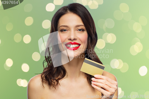 Image of beautiful woman with red lipstick and credit card