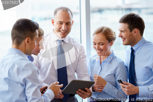 Image of business team with tablet pc computer at office