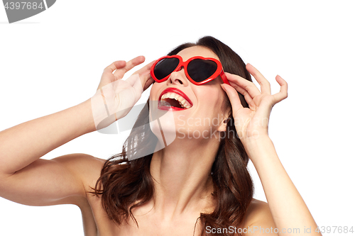 Image of woman with red lipstick and heart shaped shades