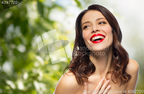 Image of beautiful laughing young woman with red lipstick