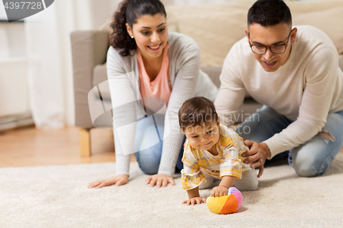 Image of happy family and baby daugter playing at home