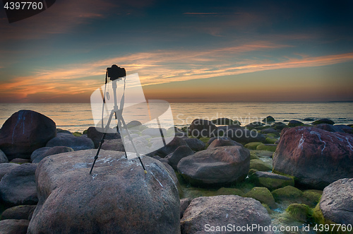 Image of Camera on tripod near a sea