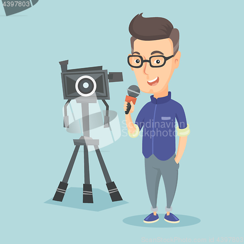 Image of TV reporter with microphone and camera.