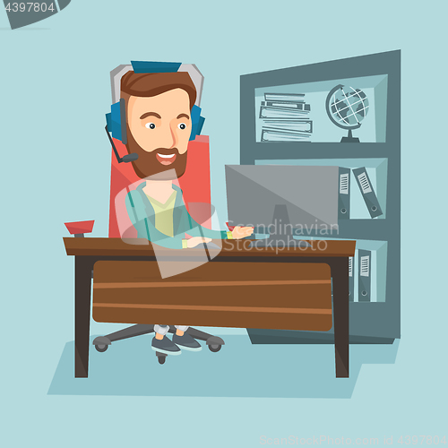 Image of Business man with headset working at office.