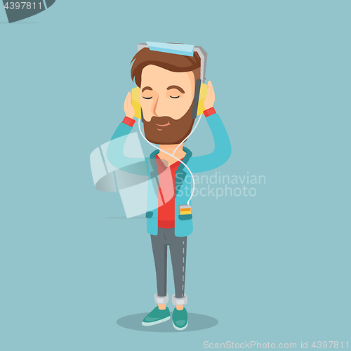Image of Young man in headphones listening to music.
