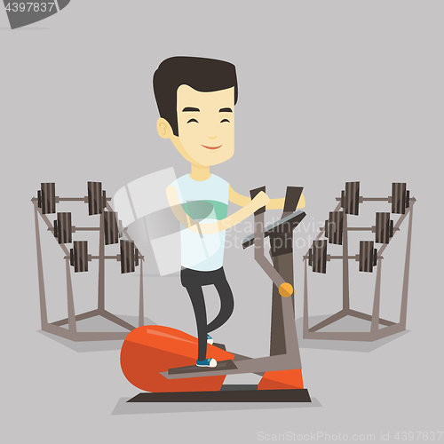 Image of Man exercising on elliptical trainer.