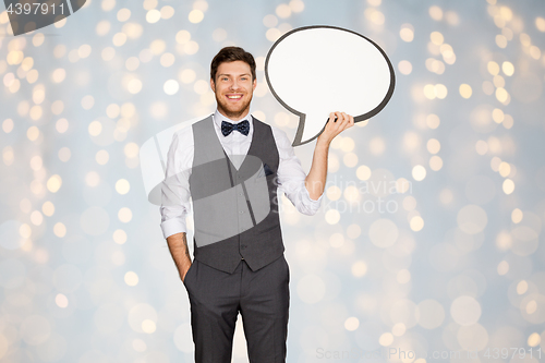 Image of happy man in suit holding blank text bubble banner