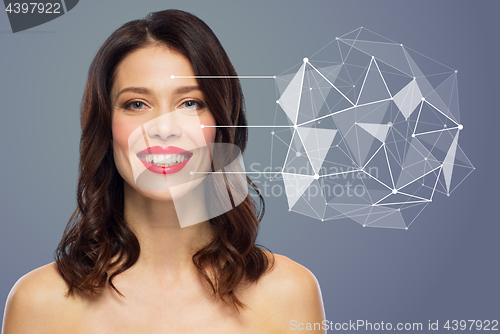 Image of beautiful woman with low poly hologram on skin