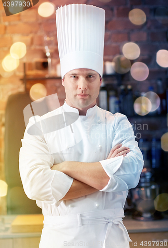 Image of happy male chef cook in restaurant kitchen