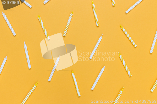 Image of Birthday candles on bright yellow background