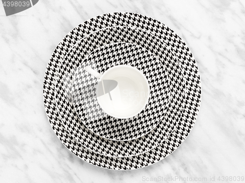 Image of Coffee cup with a set of saucers on marble background