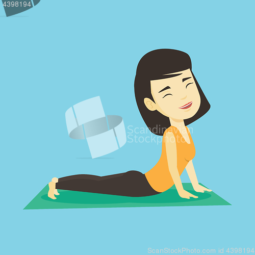 Image of Woman practicing yoga upward dog pose.