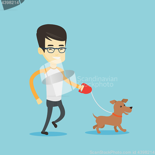 Image of Young man walking with his dog.