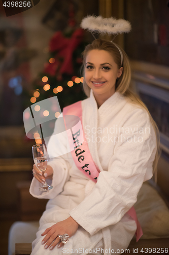 Image of woman drinking champagne at spa