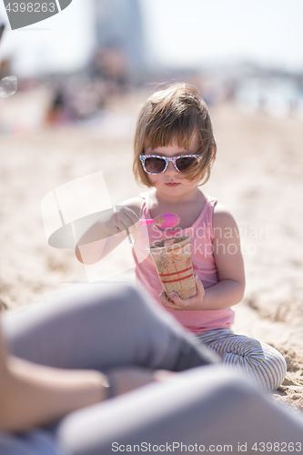 Image of Mom and daughter on the beach