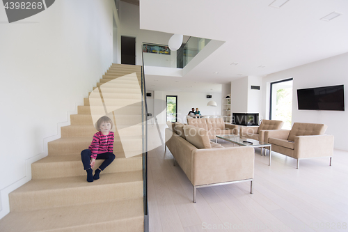 Image of family with little girl enjoys in the modern living room