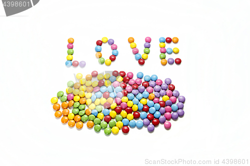 Image of Word ''Love'' and bright colorful candy 