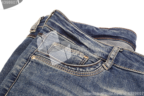 Image of Fragment of dark blue jeans isolated on white