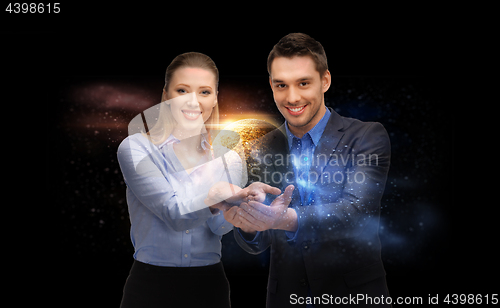 Image of businessman and businesswoman over space