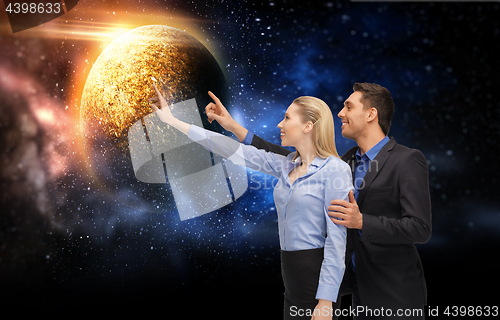 Image of businessman and businesswoman over space