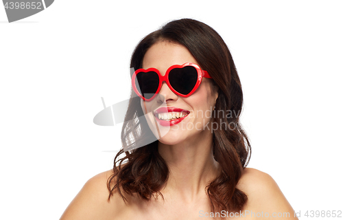 Image of woman with red lipstick and heart shaped shades