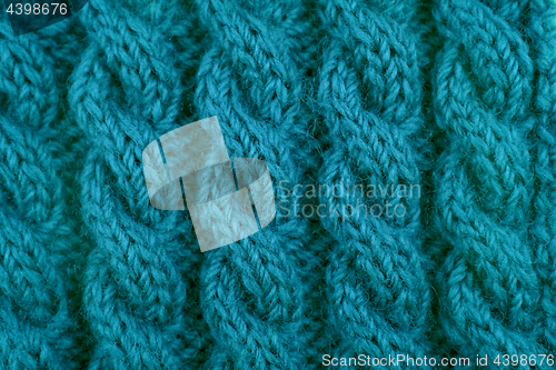 Image of Detail of teal cable knitting stitch