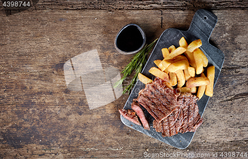 Image of grilled beef steak and potatoes