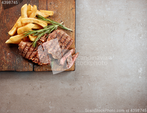 Image of grilled beef steak and potatoes