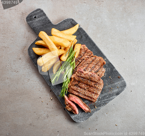 Image of grilled beef steak and potatoes