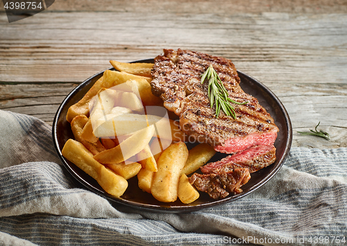 Image of grilled beef steak and potatoes