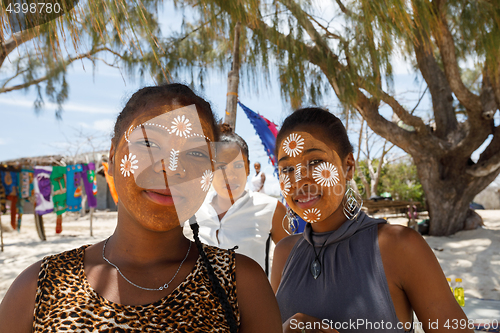 Image of Native Malagasy Sakalava ethnic girls, beauties with decorated f