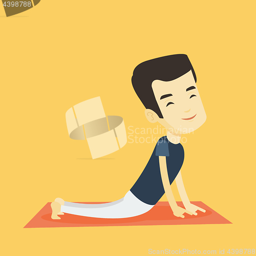 Image of Man practicing yoga upward dog pose.