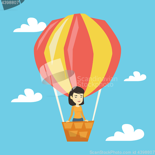 Image of Asian woman flying in hot air balloon.