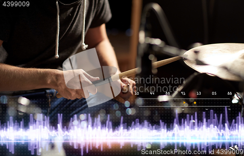 Image of drummer playing drum kit at sound recording studio