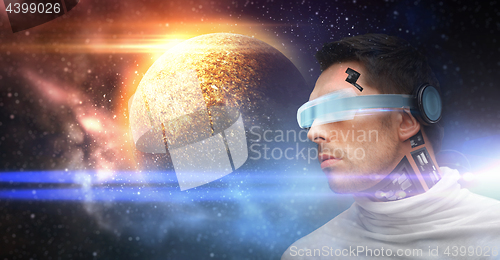 Image of male robot in 3d glasses and sensors over space