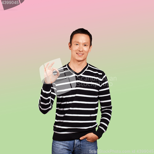 Image of Asian Man In Striped Pullover
