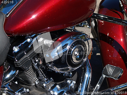 Image of Red and chrome closeup detail of motorcycle