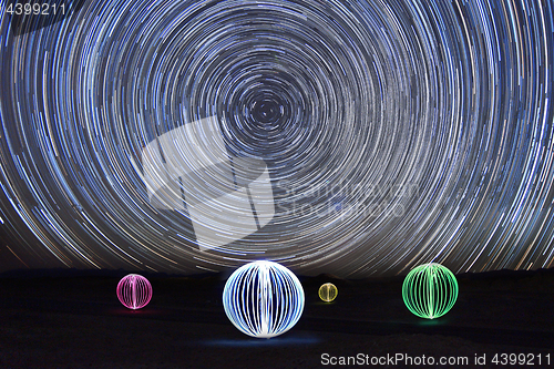 Image of Time Lapse Star Trails With Light Painted Orb Balls