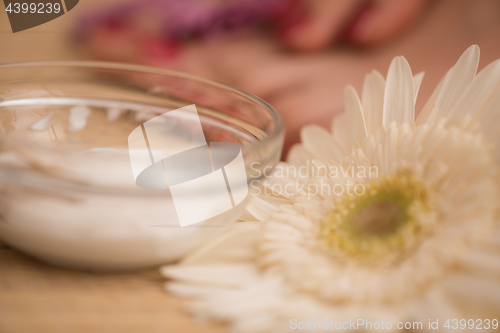 Image of female feet and hands at spa salon