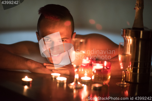 Image of man relaxing in the jacuzzi