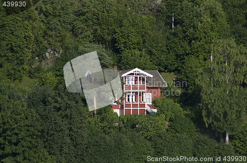Image of Red house in the forest
