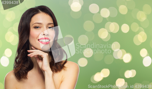 Image of beautiful smiling young woman with red lipstick