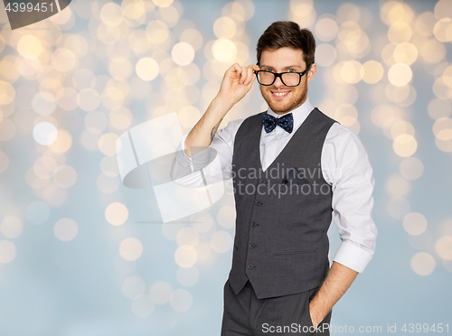 Image of happy man in festive suit and eyeglasses