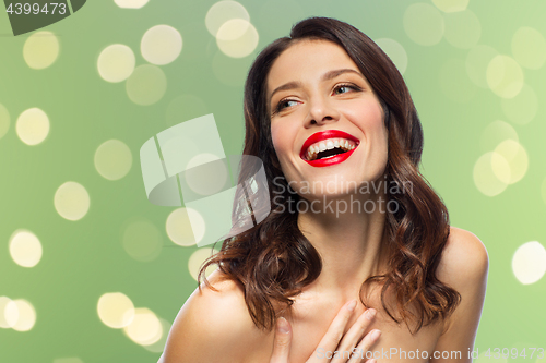 Image of beautiful laughing young woman with red lipstick