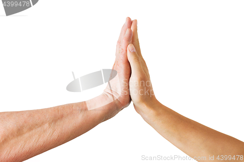 Image of close up of senior and young woman touching hands