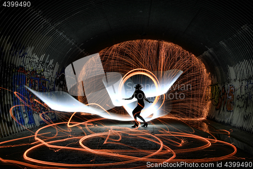 Image of Unique Creative Light Painting With Fire and Tube Lighting