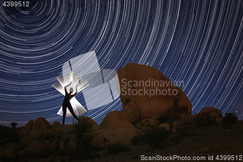 Image of Beautiful Model Lit With Light Tube With North Star Trails in Jo