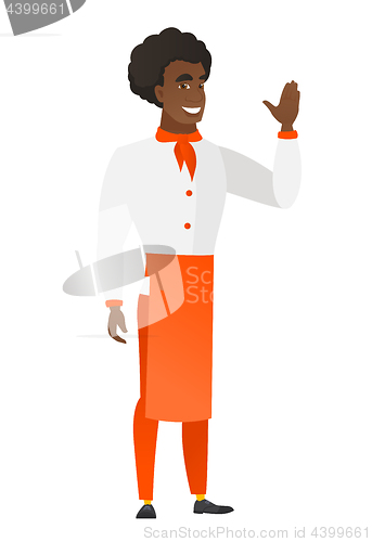 Image of Young african-american chef cook waving his hand.