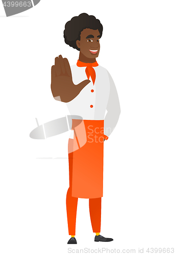 Image of African-american chef cook showing palm hand.