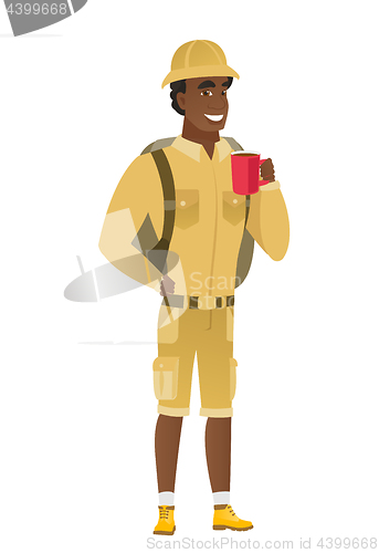 Image of African-american traveler holding cup of coffee.